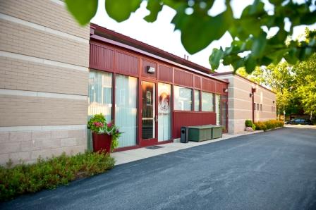 The main entrance to our building is through the glass door on the left.